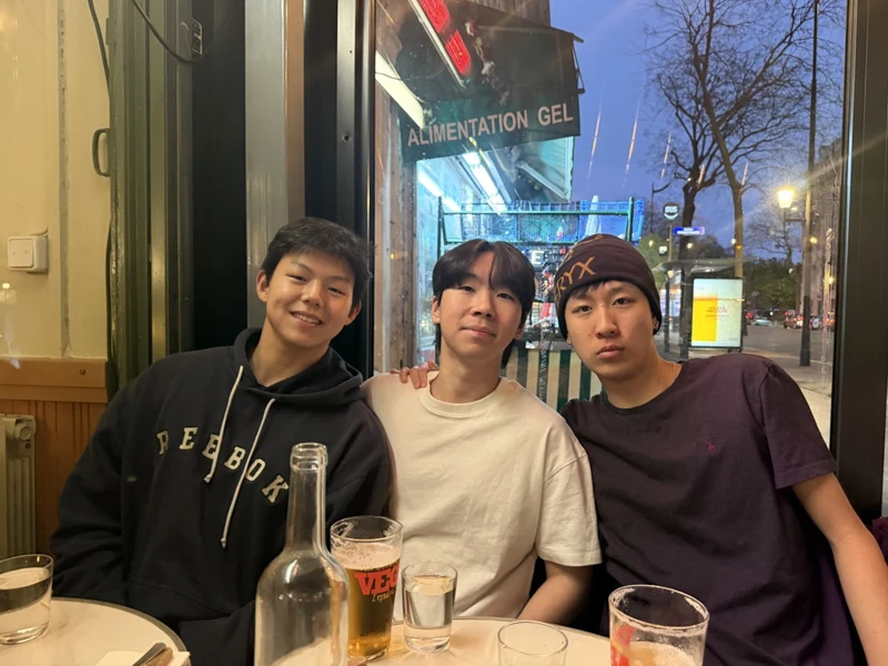 Three friends sharing an evening meal