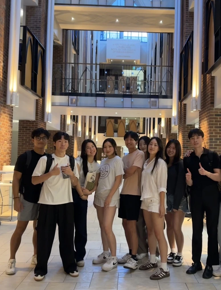 Friends together in a bright campus atrium