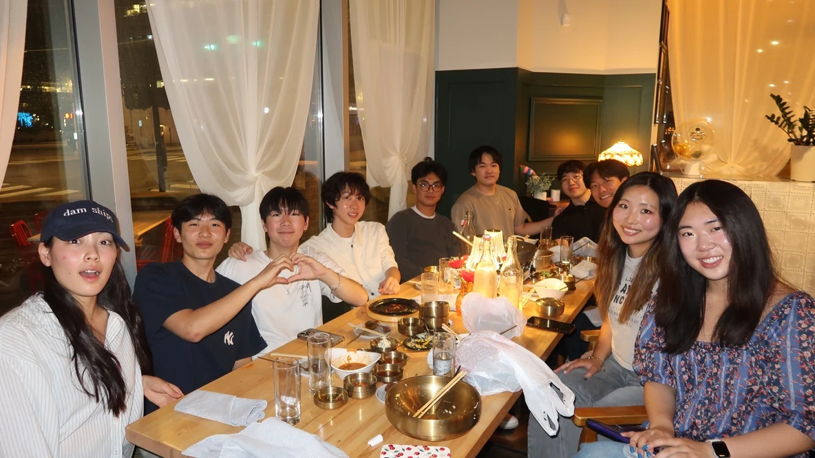 Friends sharing dinner around a restaurant table